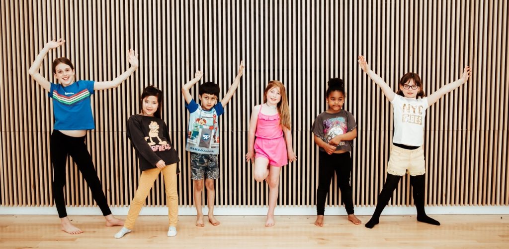 6 pupils standing in various dance poses 