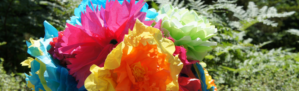 Pink, yellow and green Spring craft flower made from tissue paper 