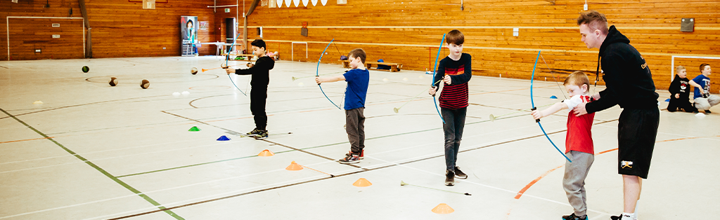 5 ways coaching impact coach children archery 1024x314 1