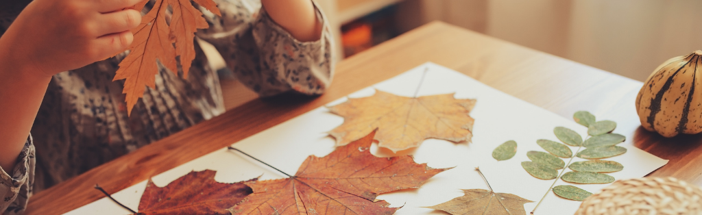 Child crafting leaf kebabs