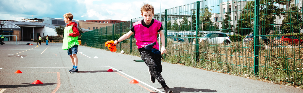 Child playing tag rugby