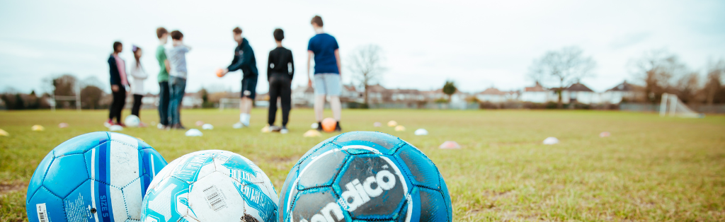 Children being coached in football