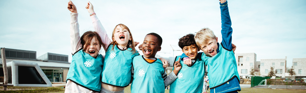 Children cheering at a Premier Education course