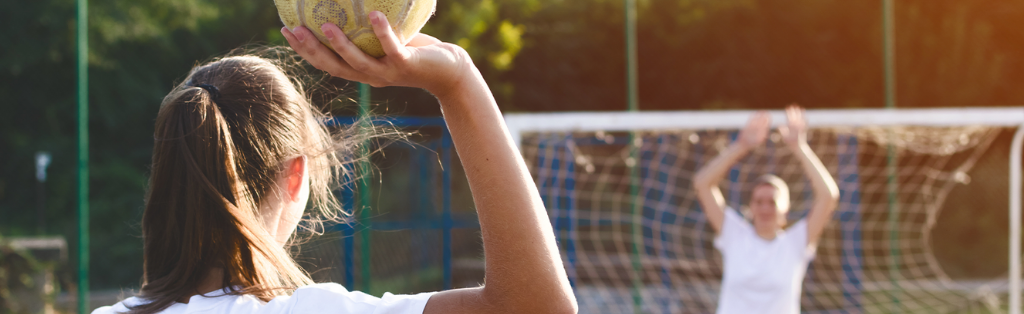 Children playing handball at a Summer Holiday Camp