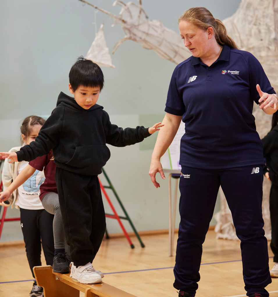 coach helping child balance