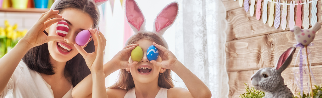 Mum and daughter posing with easter eggs