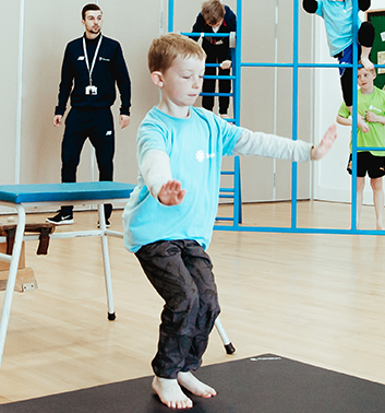 gymnastics boy jump landing