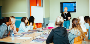 Jan miller group women classroom 704x360 1