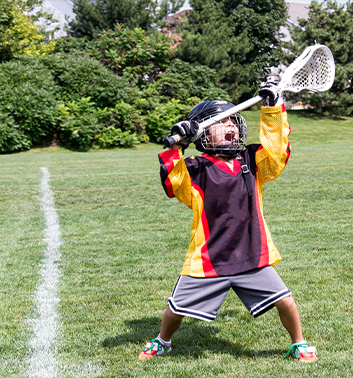 Lacrosse boy holding racket 353x378 1