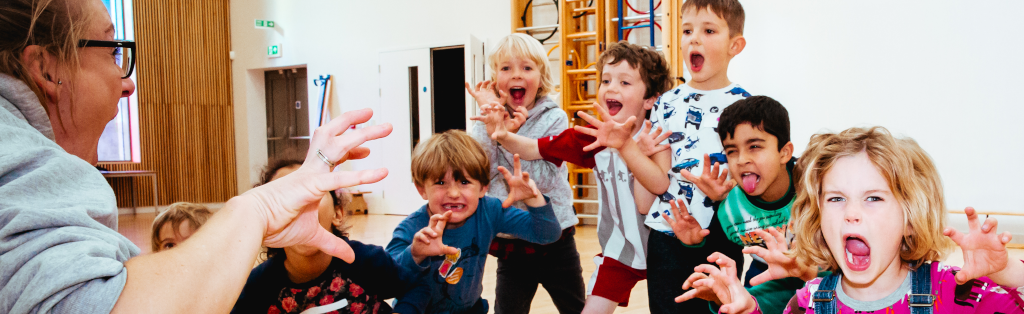 Children posing as part of a drama session at a Premier Education Holiday Camp.