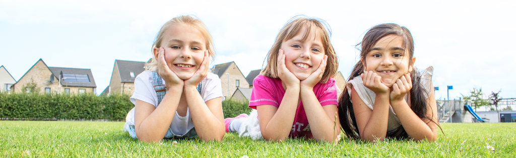 Wellbeing girls smiling 1024x314 1